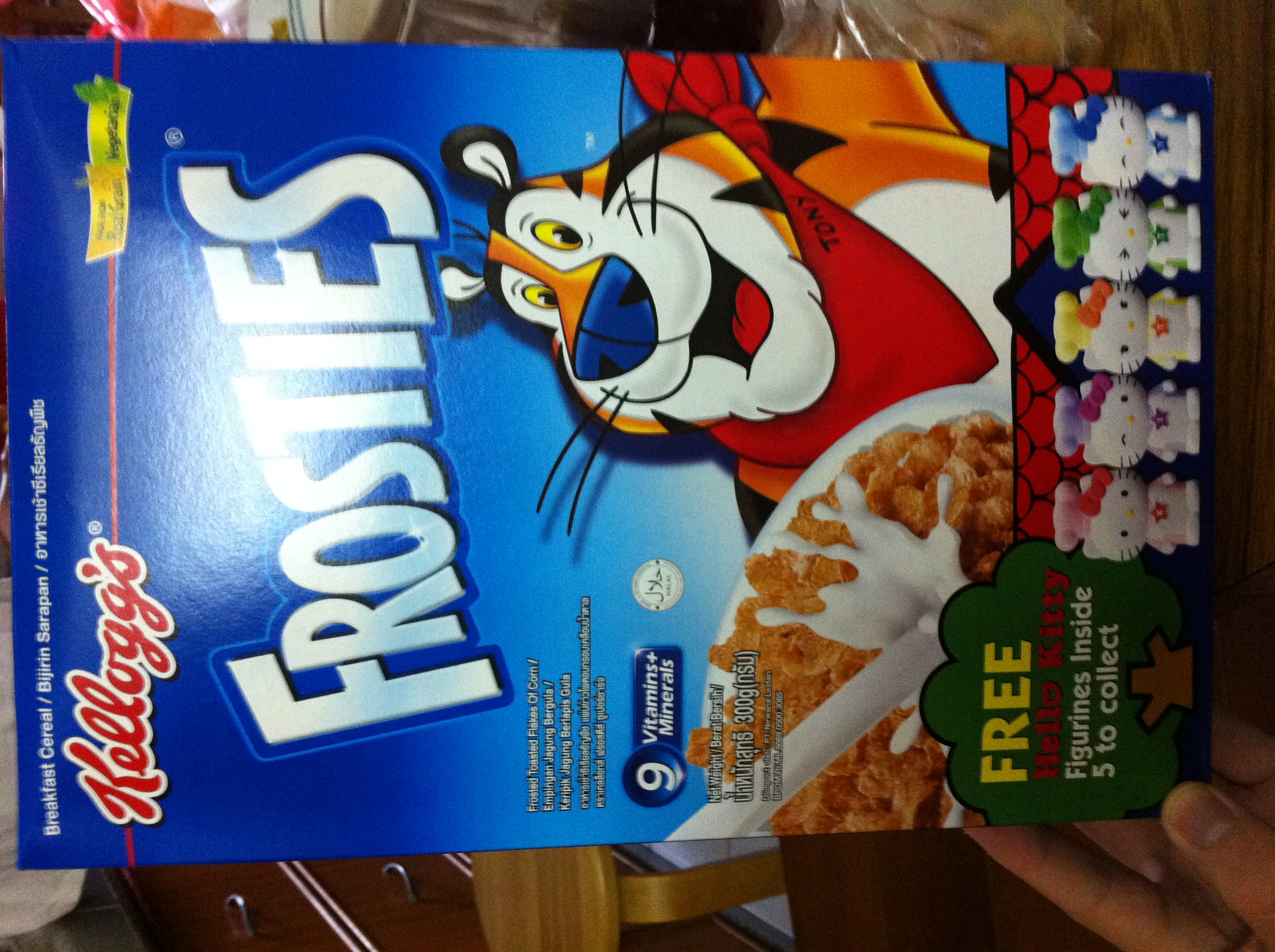 A box of Kellog's Frosties cereal with free Hello Kitty figurine
