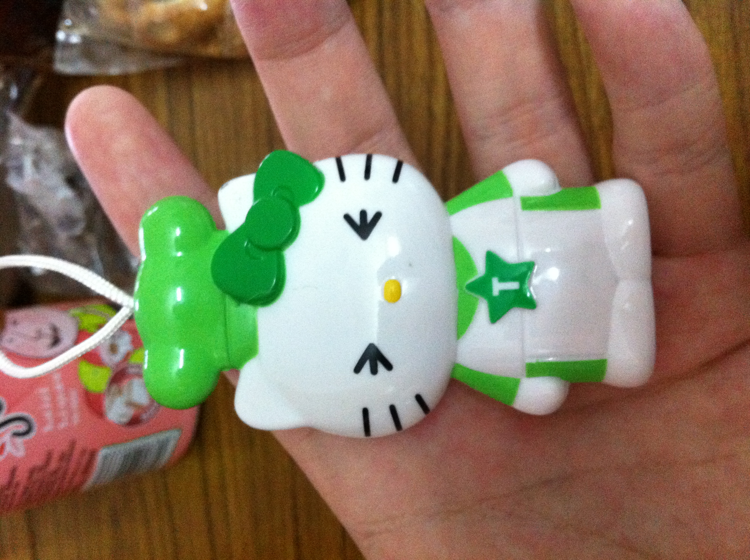 The green Hello Kitty figurine from the aforementioned Frosties cereal box