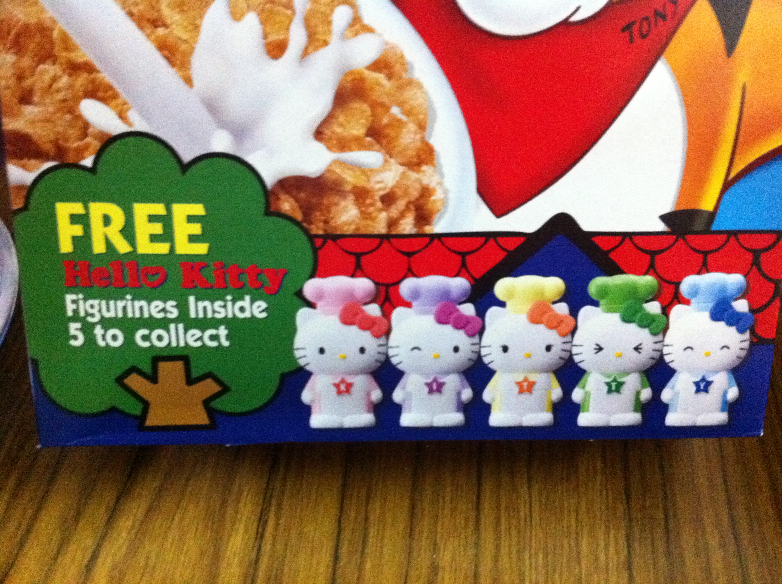 A zoomed-in shot of the collectible Hello Kitty figurines from the Frosties box