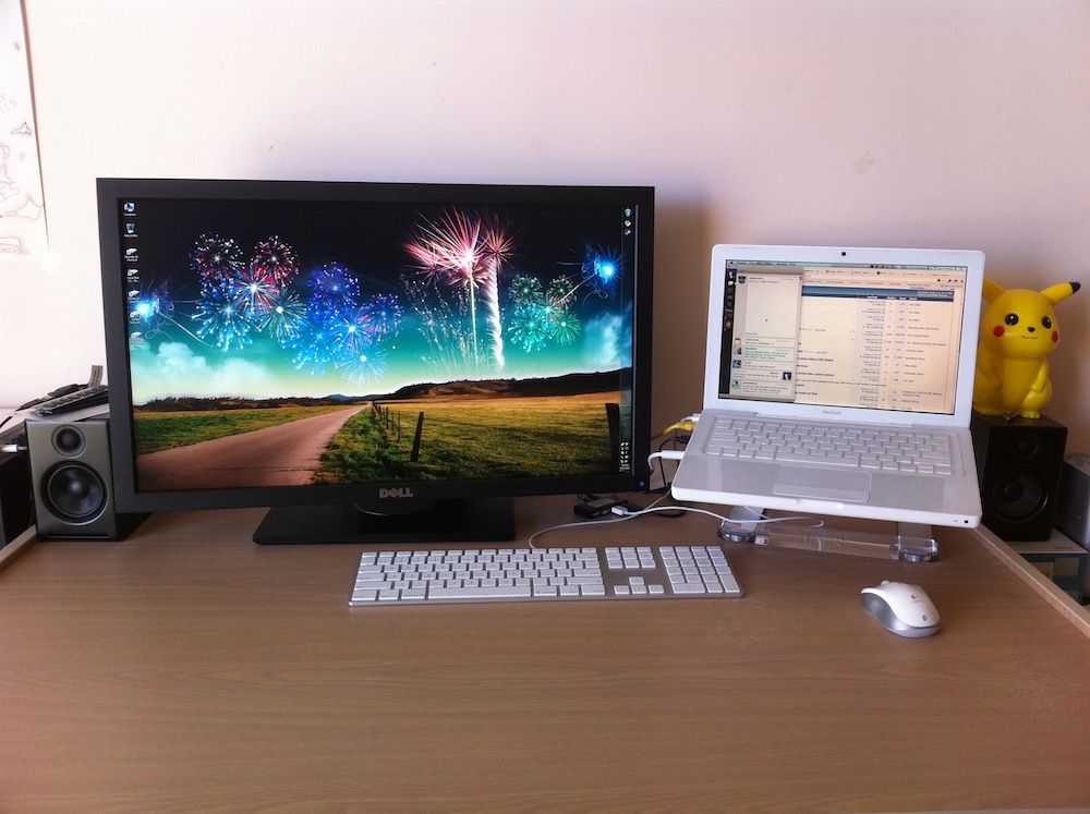 Dell U2711 beside a white MacBook