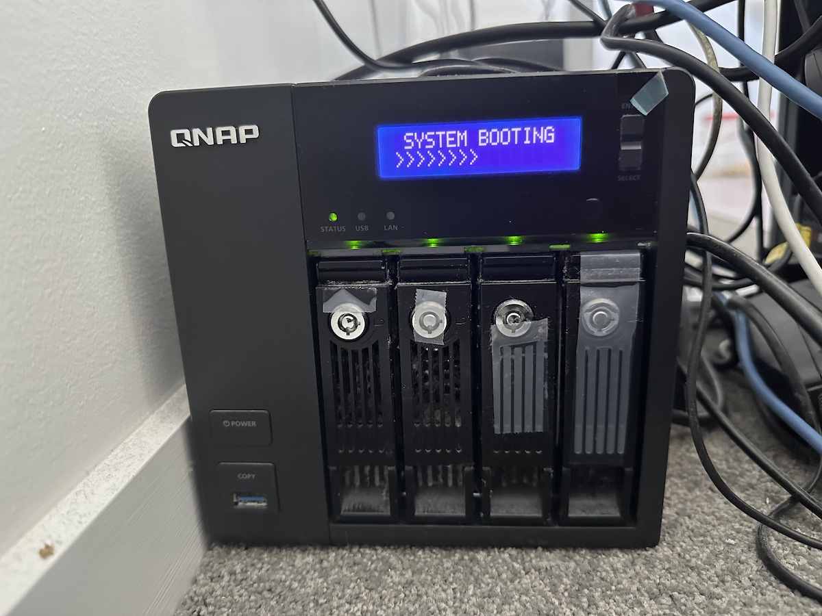 A QNAP NAS with System Booting text