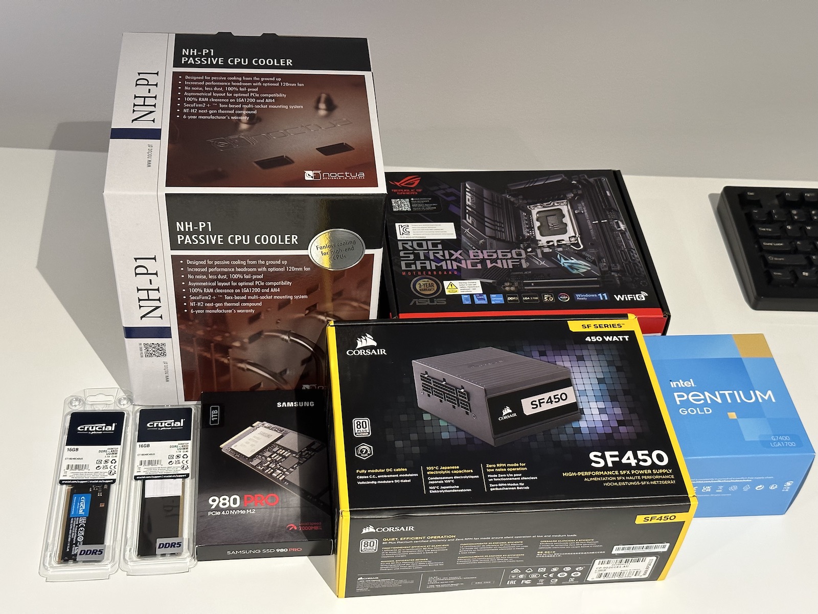 Boxed PC parts for a custom NAS build arranged aesthetically