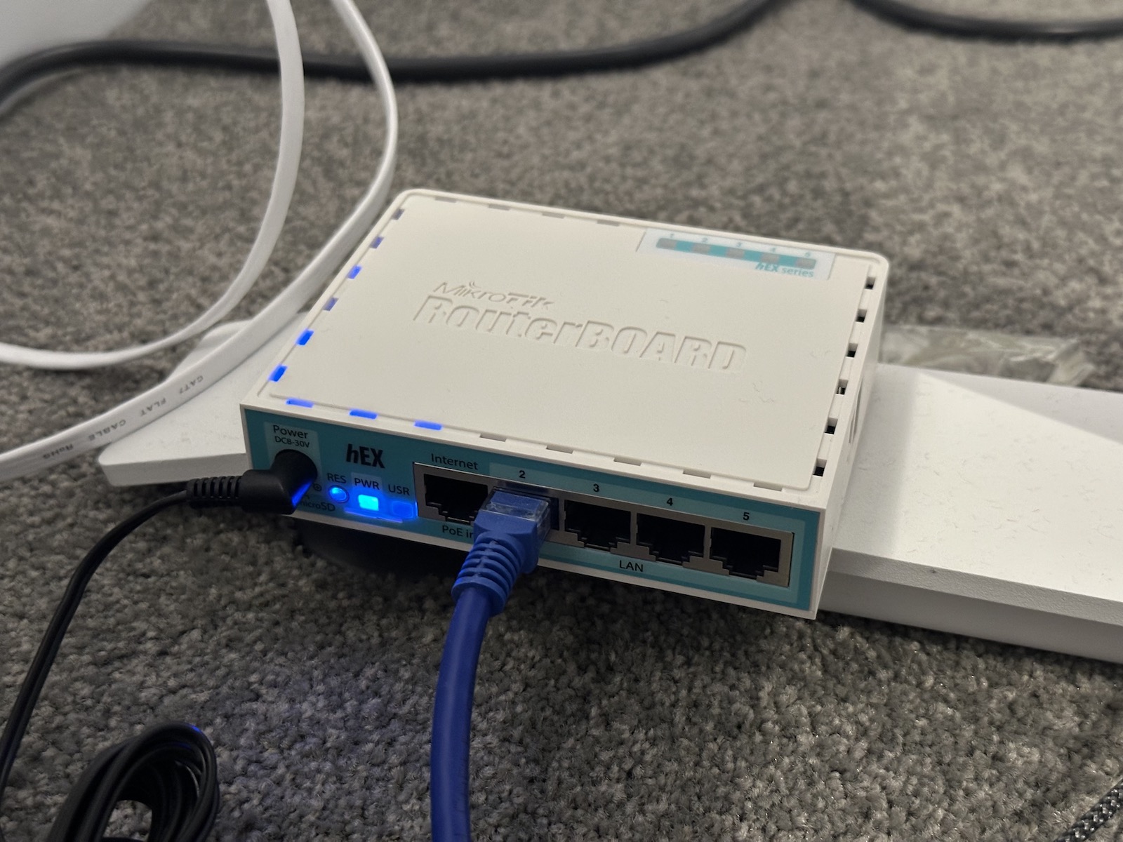 A MikroTik RB750Gr3, otherwise known as the hEX. 